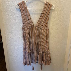 Size small striped dress. Solid color is pink and the stripes are multicolor